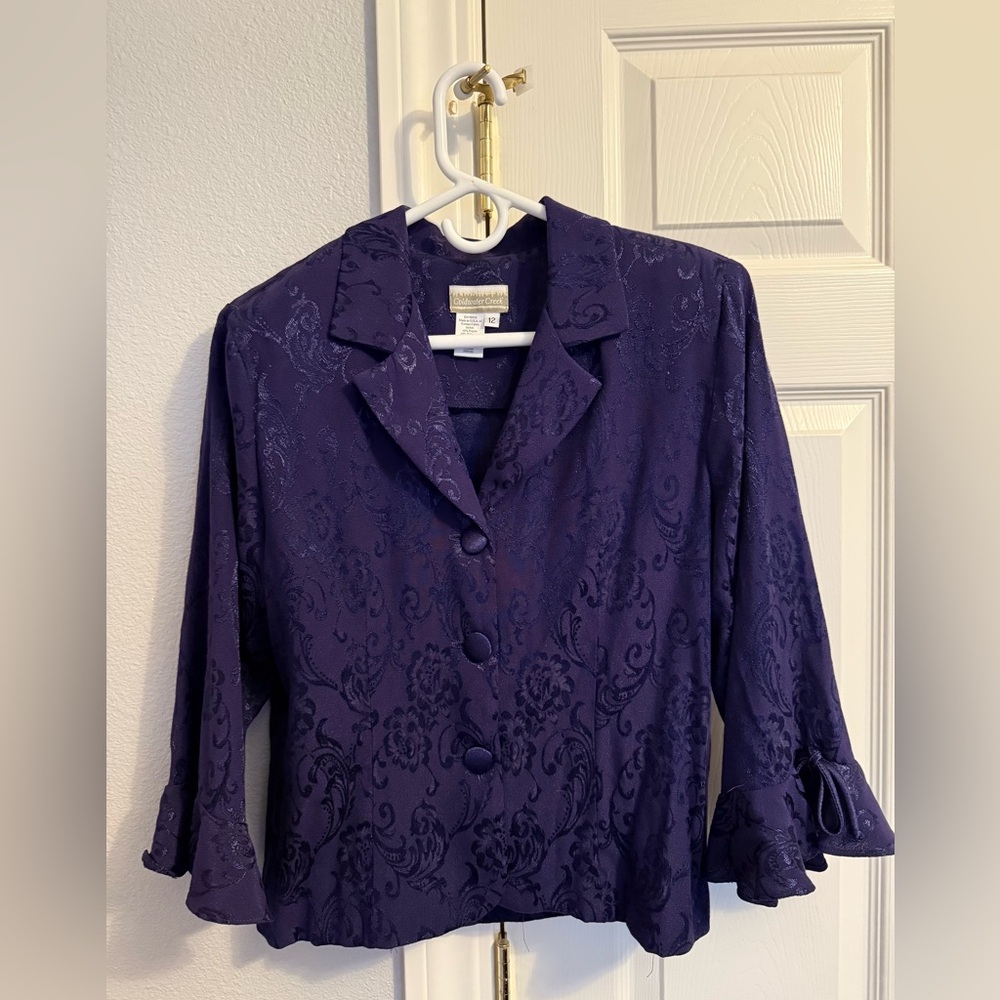 Purple suit jacket with shimmer accents and ruffle sleeves